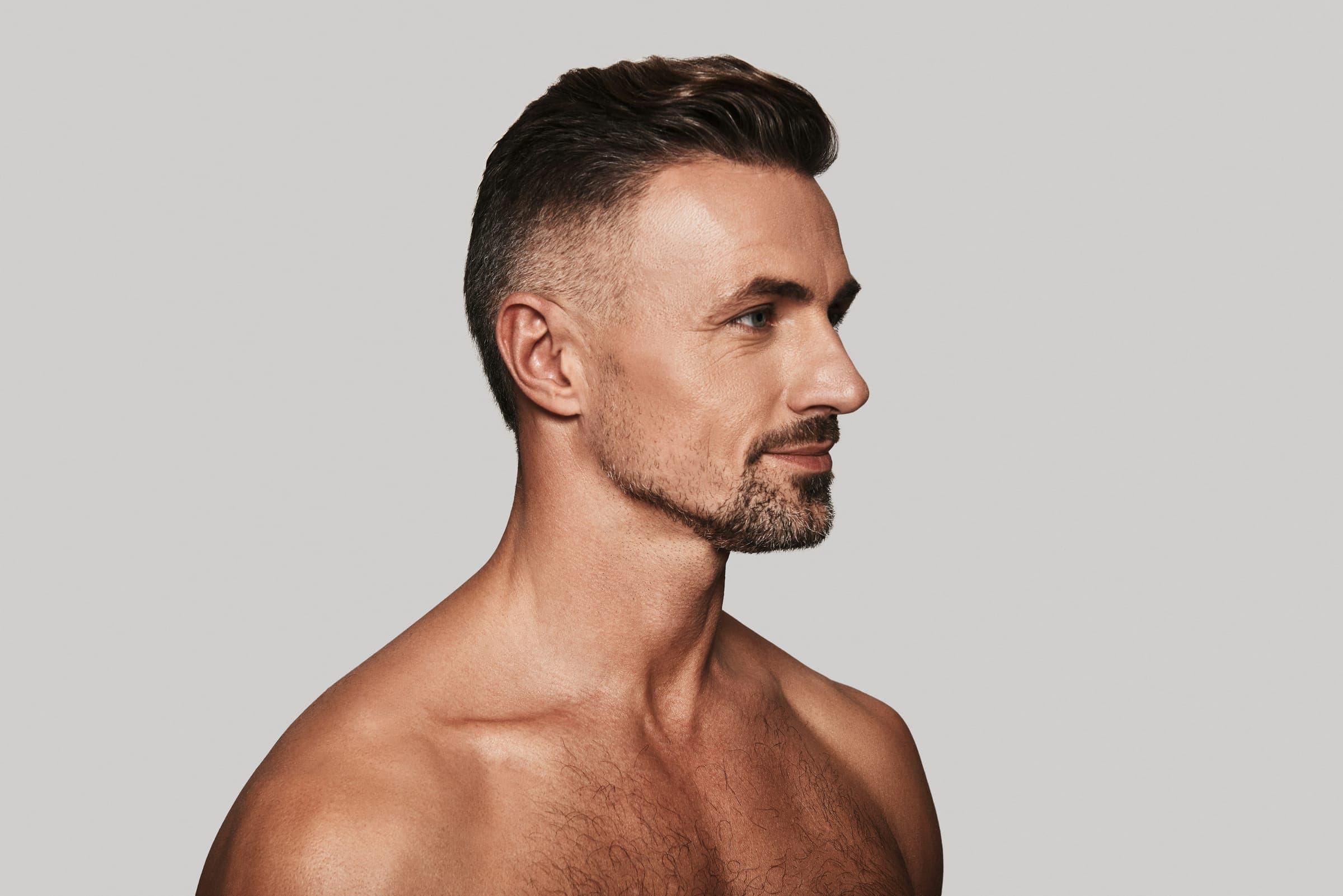 Man with full hair in soft daylight