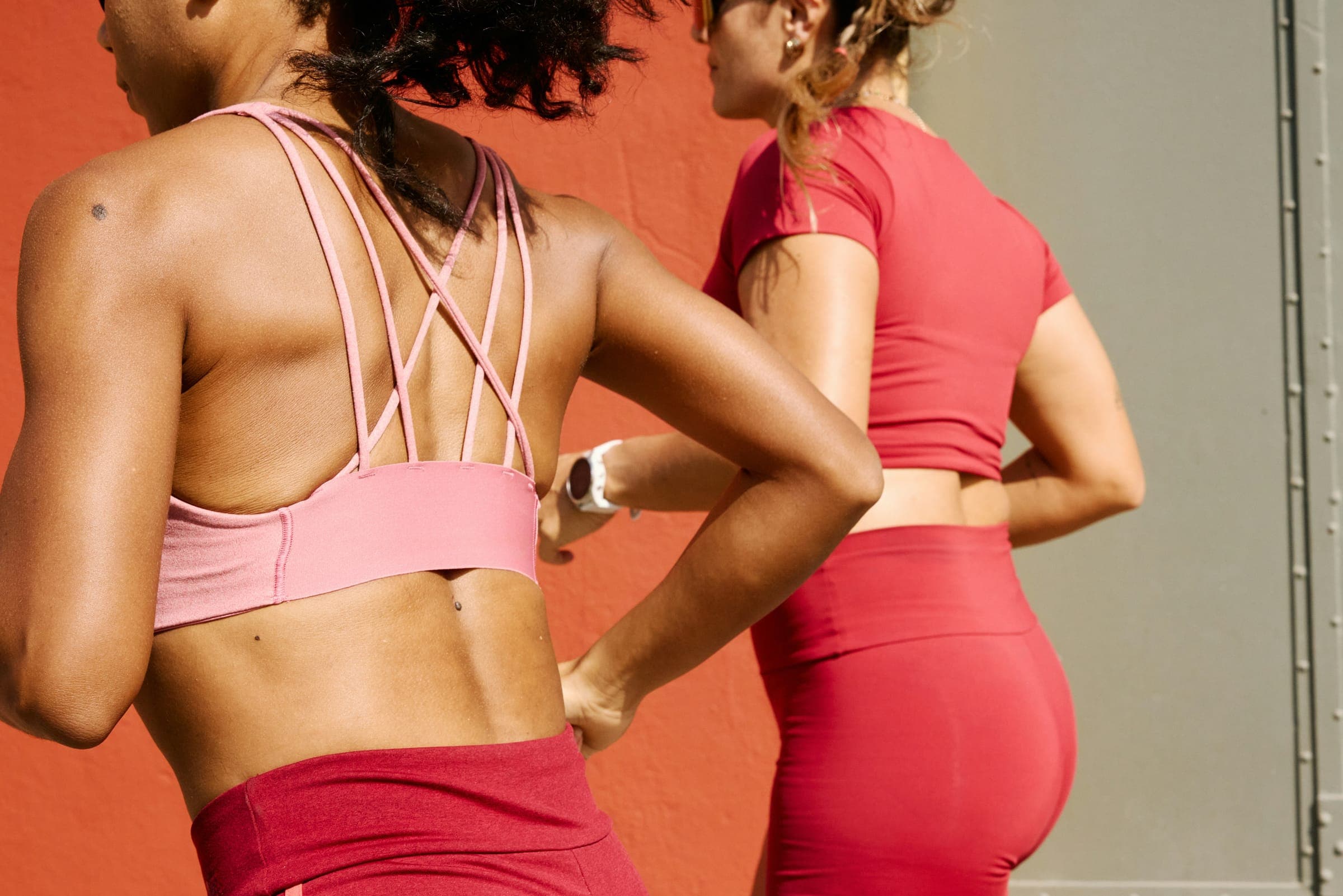 Two women in pink workout gear after training