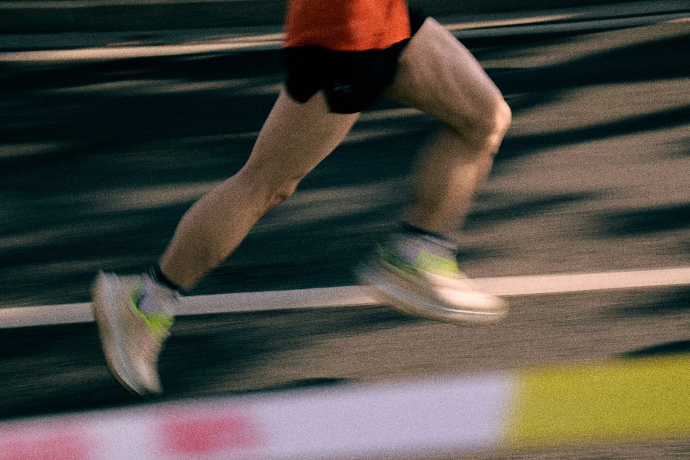 Runner mid-stride at sunrise